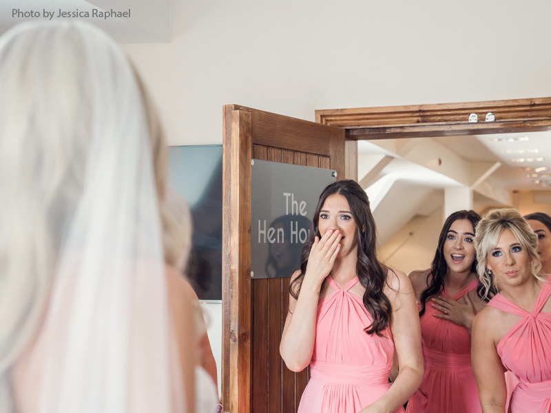 Bride reveals the wedding dress to her emotional bridesmaids